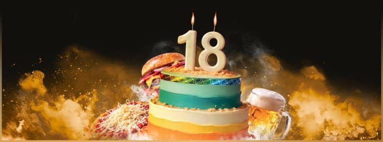 Dort se svíčkou ve tvaru čísla 18, jídlo a pivo