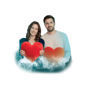 Muž a žena držící velké červené srdce