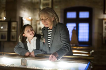 Friendly,Aged,Female,Tutor,Helping,Preteen,Girl,Exploring,Antique,Showpieces